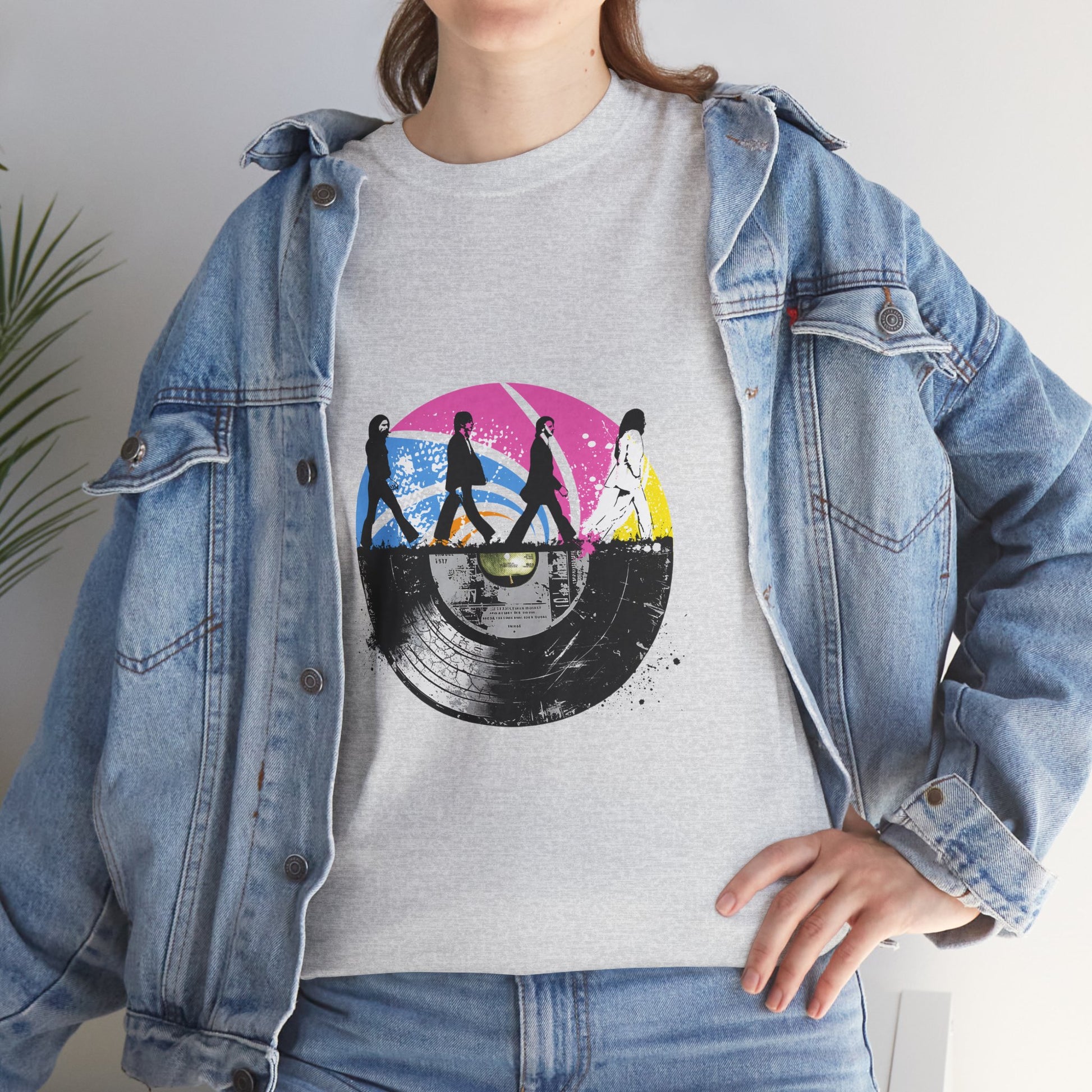Unisex heavy cotton t-shirt featuring an original Beatles tribute design. This tee blends a classic Abbey Road silhouette with a vibrant vintage vinyl record print, capturing retro rock vibes and timeless nostalgia. Perfect for concerts, casual hangouts, and music-themed events.