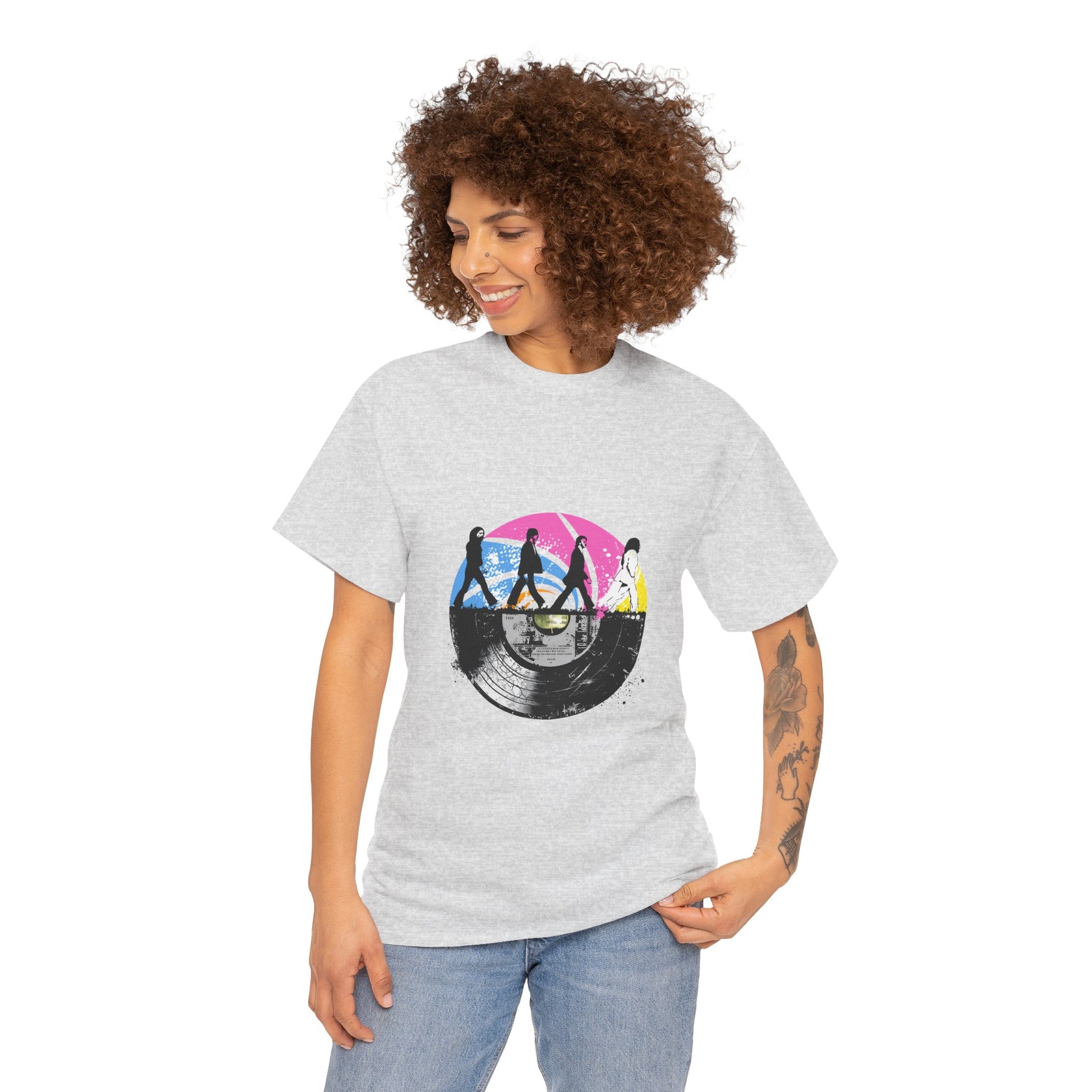 Unisex heavy cotton t-shirt featuring an original Beatles tribute design. This tee blends a classic Abbey Road silhouette with a vibrant vintage vinyl record print, capturing retro rock vibes and timeless nostalgia. Perfect for concerts, casual hangouts, and music-themed events.
