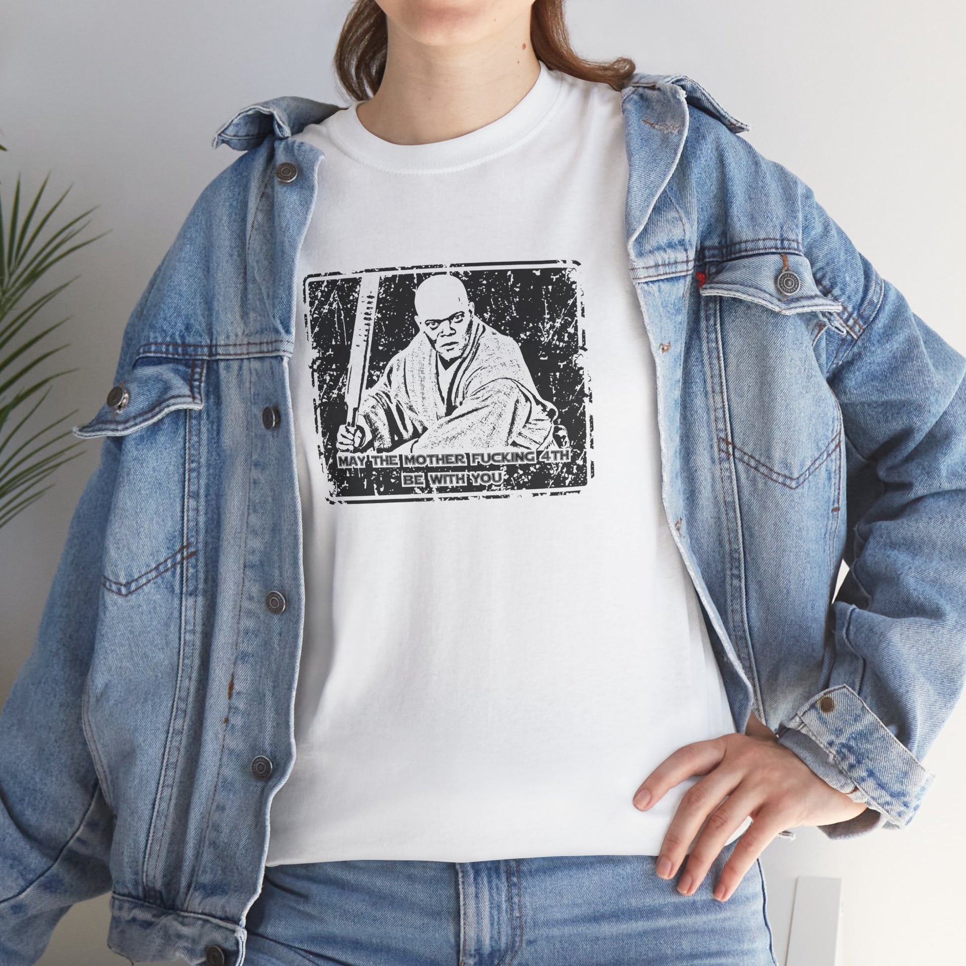 "May the 4th be With You" vintage t-shirt featuring an iconic Mace Windu design. Celebrate Star Wars fandom with an edgy twist on Jedi lore, incorporating rebellious Sith vibes and a retro aesthetic perfect for science fiction fans.